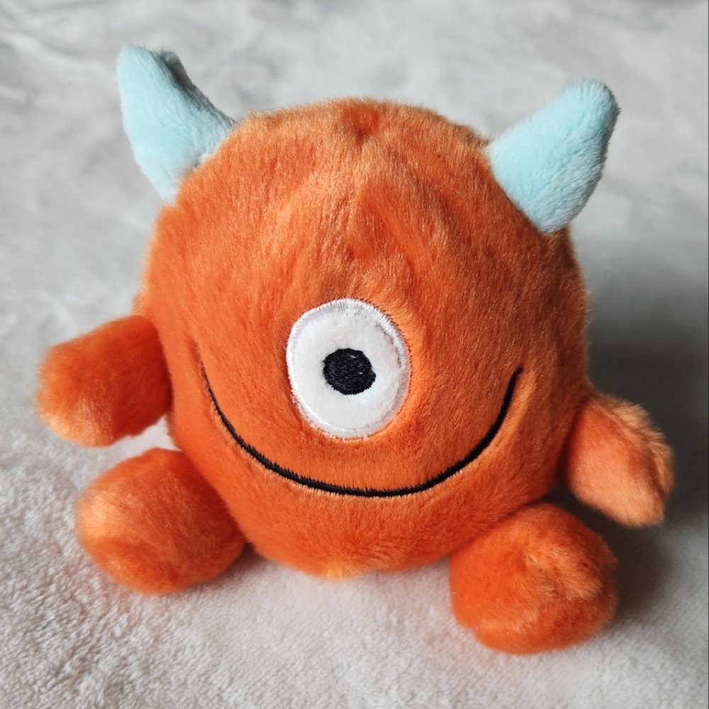 NWOT! Little Orange Plush Palm Pal Monster